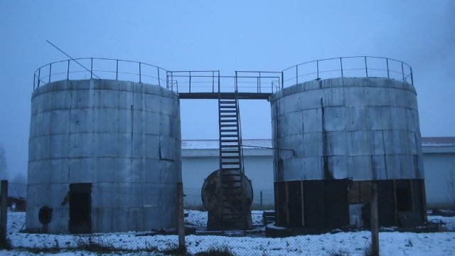 a pair of old steel oil tanks